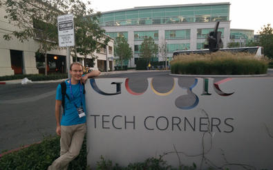 Person standing next to the Google Tech Corners logo