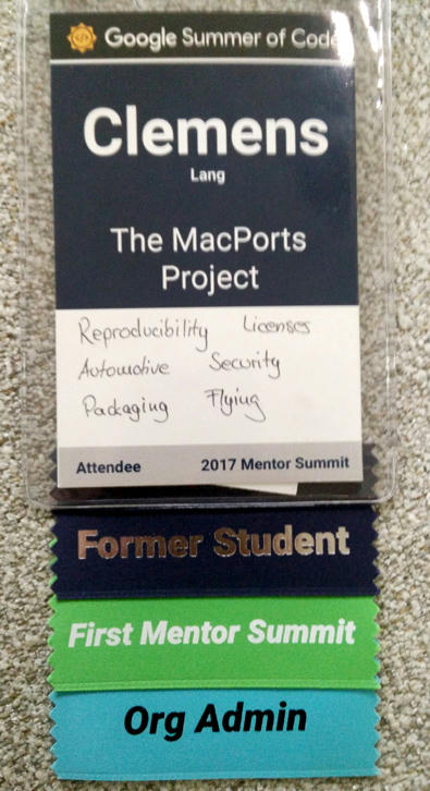 Mentor Summit Badge for Clemens Lang from the MacPorts Project, mentioning talking points Reproducibility, Licenses, Automotive, Security, Packaging and Licensing, and displaying flags Former Student, First Mentor Summit, and Org Admin